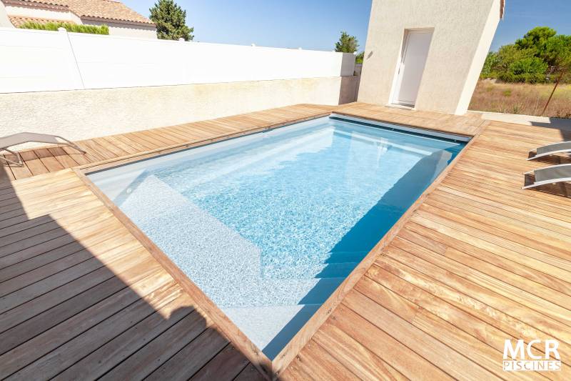 Piscine MOANA posée à Générac près de Vauvert, avec couverture immergée. - MCR Piscines et Spas - Nîmes